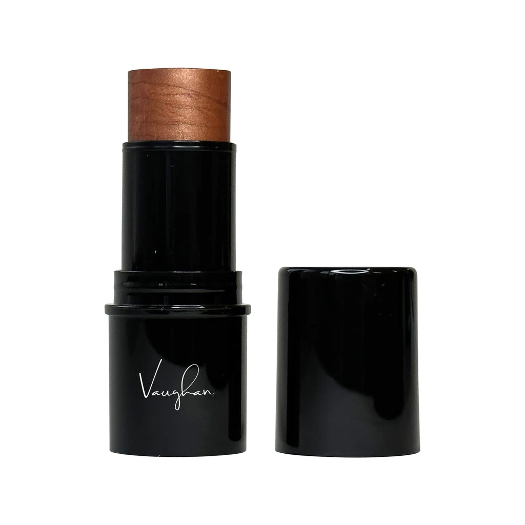 Black makeup stick with wooden top on a white background
