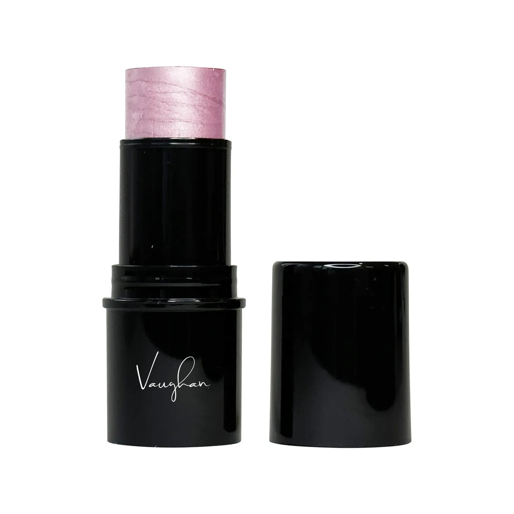 Black lipstick with pink cap on a white background